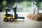 Miniature banker sit on yellow forklift go to move home to another location