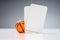 Miniature Basketball With White Blank Tickets On Reflective Desk