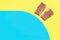 Miniature beach chairs on yellow and blue paper. Summer vacation concept