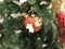 MINIATURE BEAR CHRISTMAS TOY ON THE FIR TREE