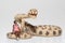 Miniature of a black woman sitting on a rattlesnake