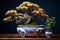 Miniature bonsai tree in blue ceramic pot on wooden table