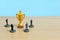 Miniature business concept - businessman lineup rank with golden trophy in the middle