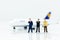 Miniature business people : businesses team with plane. Image use for background travel, business trip travel advisory agency