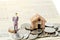 Miniature businessman stand on the heap coins on book bank background.