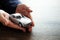 Miniature car model on hand, Auto dealership and rental concept