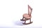 Miniature chair on wooden floor expressing lonely feeling and missing someone concept