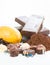 Miniature chefs and cocoa ingredients over white background