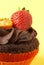 Miniature chocolate cupcake with strawberry