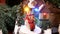 Miniature Christmas decorated houses with dancing doll and snowman.