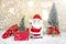 Miniature Christmas Santa cros and Tree on snow over blurred bokeh background,Decoration Image for Christmas Holiday and Happy New