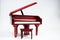 Miniature classic piano keyboard instrument  on white background