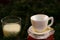 Miniature coffee cup and white candle