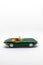 Miniature convertible green car isolated on a white background