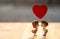 Miniature Couple dolls Boy and Girl Romantic Kiss with Red Heart on above for Background for valentine`s Day Concept