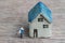Miniature couple, happiness husband and wife with ceramic house