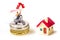 Miniature couple on stack coins with tiny home isolate on white background,Image for Christmas and holiday home and money  managem