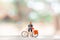 Miniature cyclist standing with bike, World bicycle day concept