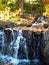 Miniature effect of small waterfall in outdoor park