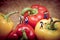 Miniature farmers harvesting his bell peppers