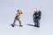 Miniature figure concept of photographer with a couple senior people