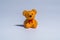 Miniature figure of yellow Teddy bear