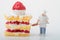 Miniature figurine of a cook with a giant slice of cake