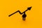 Miniature figurine posed as businessman in front of ascending graph arrow