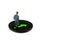 Miniature figurine posed as visualising businessman standing on green arrow marking the way moving forward, minimalist abstract