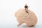 Miniature figurine of a woman sitting on a giant brain