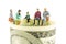 Miniature figurines discussion on the edge of 100 dollar banknote