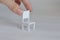 Miniature furniture made of cardboard, painted white. Doll table with chair scale 1:24