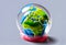 Miniature globe enclosed in plastic wrap