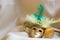 Miniature golden decorative mask with feathers