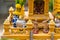 Miniature guardian spirit house. Small buddhist temple shrine, colorful flower garlands. San phra phum erected to bring fortune.