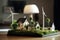 miniature house model with wind turbine toy on an architect or sales agent desk, sustainable real estate concept idea