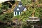 Miniature house on the side of a pond in Halifax, Germany