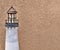 Miniature Lighthouse Sculpture against background