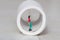 Miniature little people, woman inside of a paper toilet, in a white background