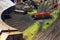 A miniature locomotive depot with railroad tracks, locomotives and buildings..