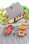 Miniature mechanics servicing and repairing cars top view