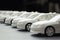 Miniature models of white cars in a row. Generative ai