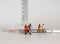 Miniature old age people and the syringe. Concepts on the importance of health care for the elderly.