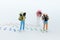 Miniature people: Backpacker walking on trace. Image use for travel go around, business concept