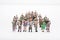 Miniature people business standing in crowd over white backdrop