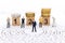 Miniature people : Businessman standing on wooden blocks with sequential numbers. Image use for business concept