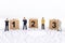 Miniature people : Businessman standing on wooden blocks with sequential numbers. Image use for business concept