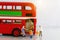 Miniature people, Children getting on the schoolbus with teacher