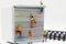 Miniature people climbing book with challenging route on cliff,