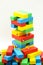 Miniature people : climbing colorful wooden block with challenging route on cliff, Concept of the path to purpose and success.